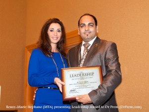 Dr Prem Recieving Leadership Award From Renee-Marie Stephano