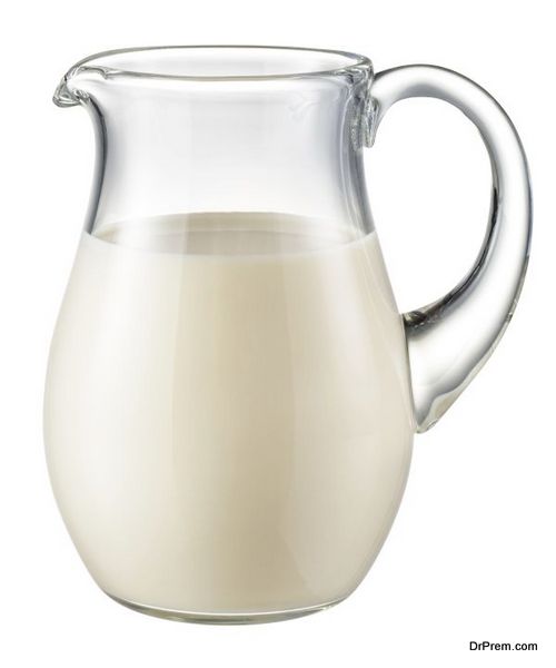 Glass jug of fresh milk isolated on white. With clipping path