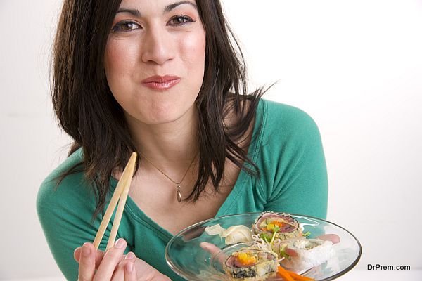 Happy Brunette Woman taking Lunch Smilin Sushi in Her Mouth