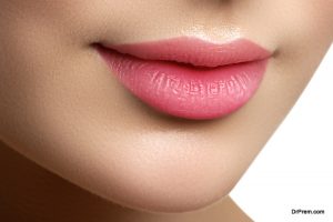 Final touch with lip gloss