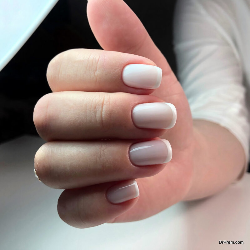 Beautiful woman's nails with beautiful french manicure