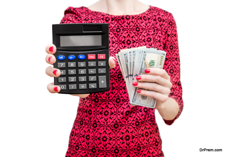 Woman in red dress showing calculator and holding money